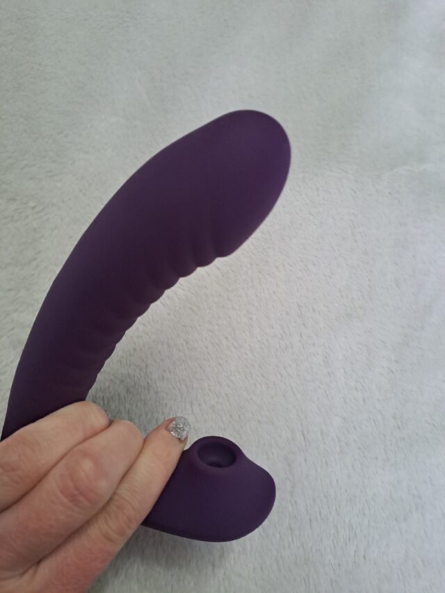 Silicone purple vibrator with curved design, removable bullet, and textured surface for enhanced pleasure, perfect for sextech enthusiasts exploring innovative adult toys and intimate wellness products.