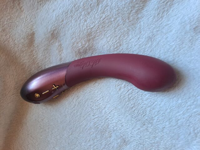 Wireless sex toy with curved design, pink finish, and control buttons for ultimate pleasure and intimacy. Ideal for remote-controlled intimacy and pleasure enhancement.