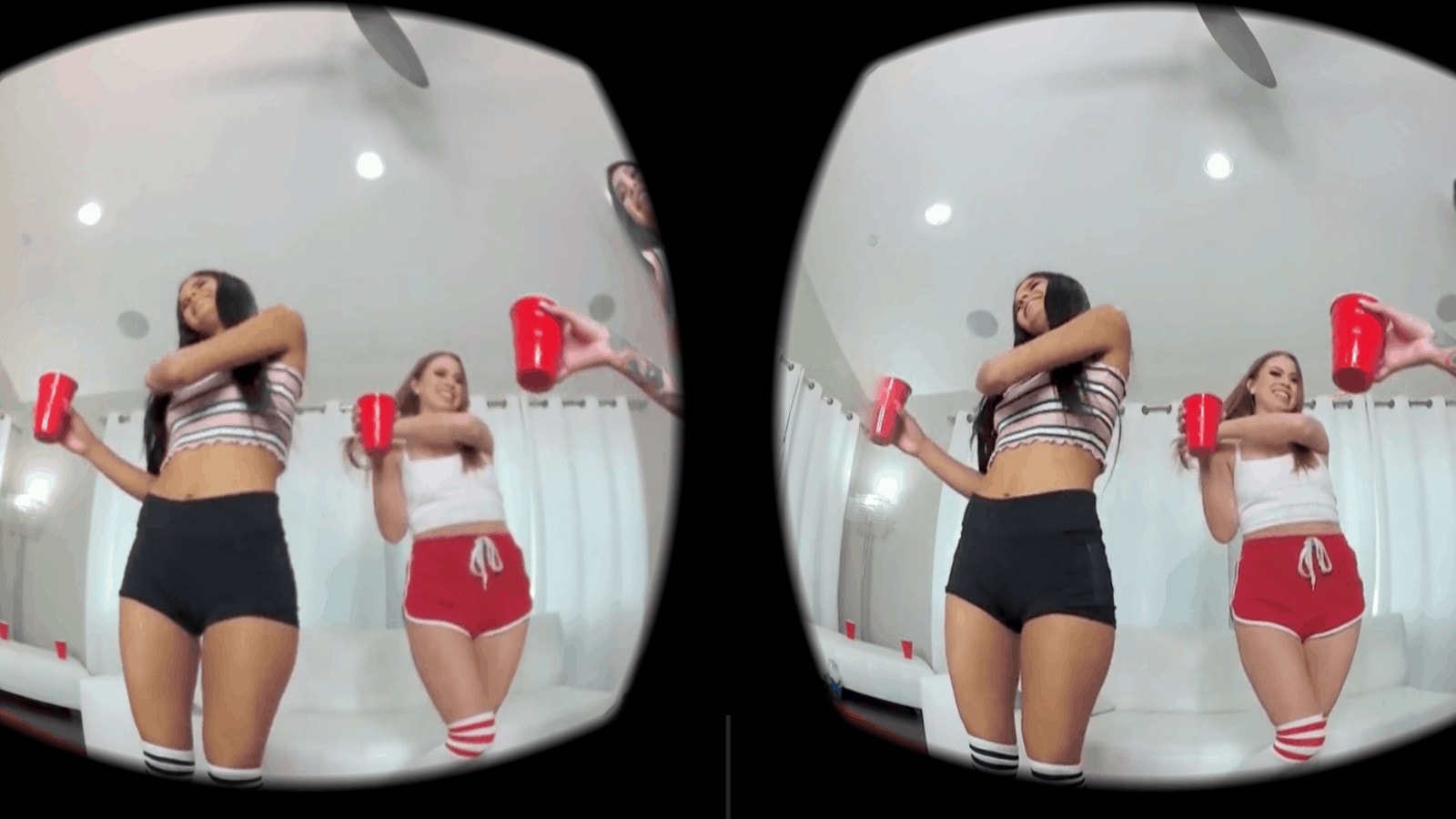 Two girls are playing a VR game.