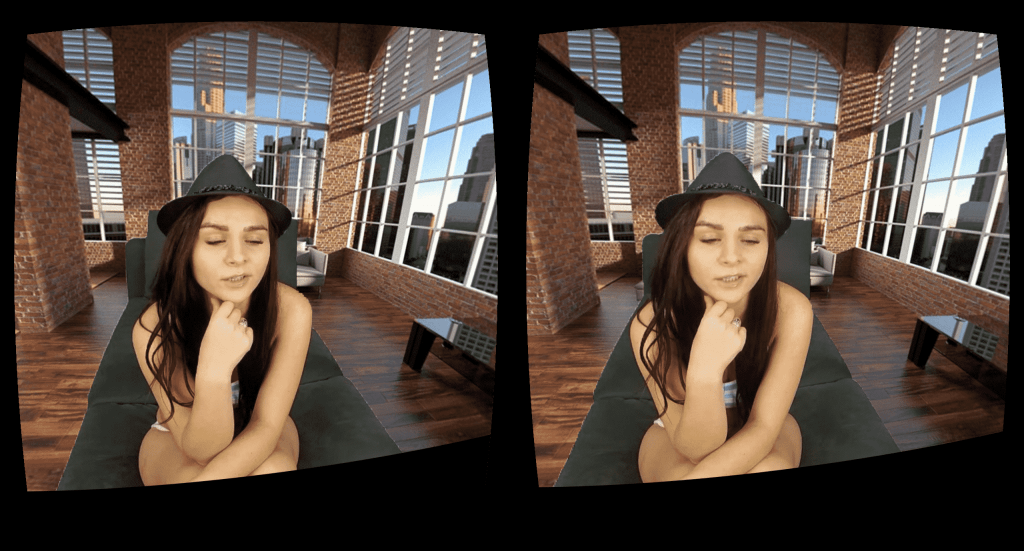 A woman is experiencing an engaging VR session on a couch.