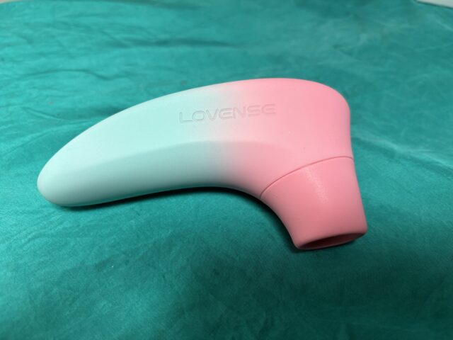 Wireless personal massager designed for intimate pleasure, featuring a sleek, ergonomic pink and white silicone body, perfect for discreet use and sensual stimulation, compatible with app control.