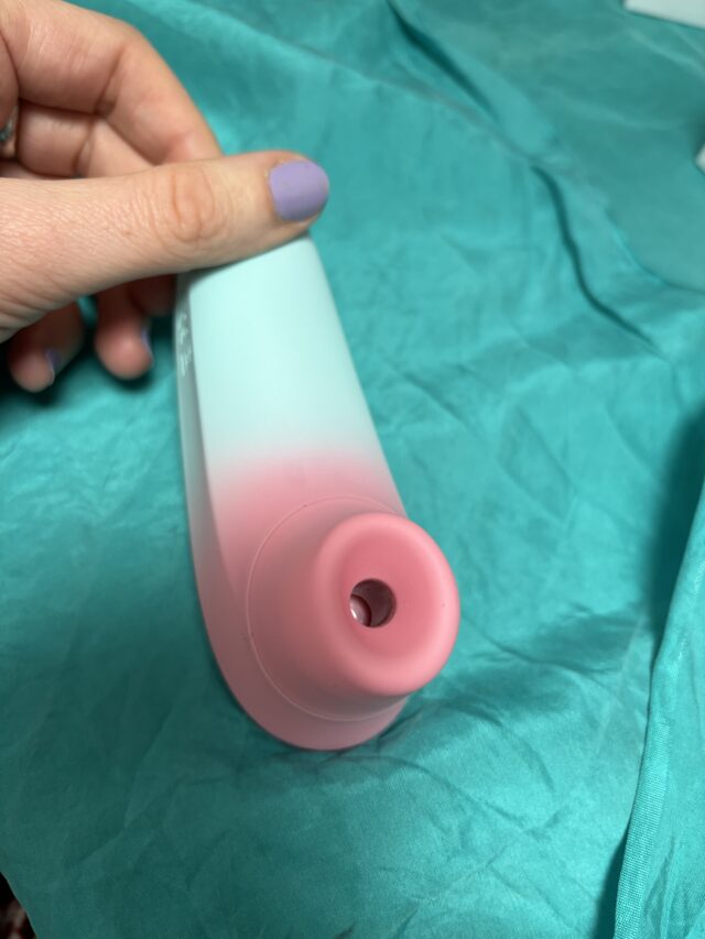 Pink and teal vibrators for sexual pleasure and intimate wellness, made of silicone, featuring ergonomic design and multiple vibration settings for customized experiences.