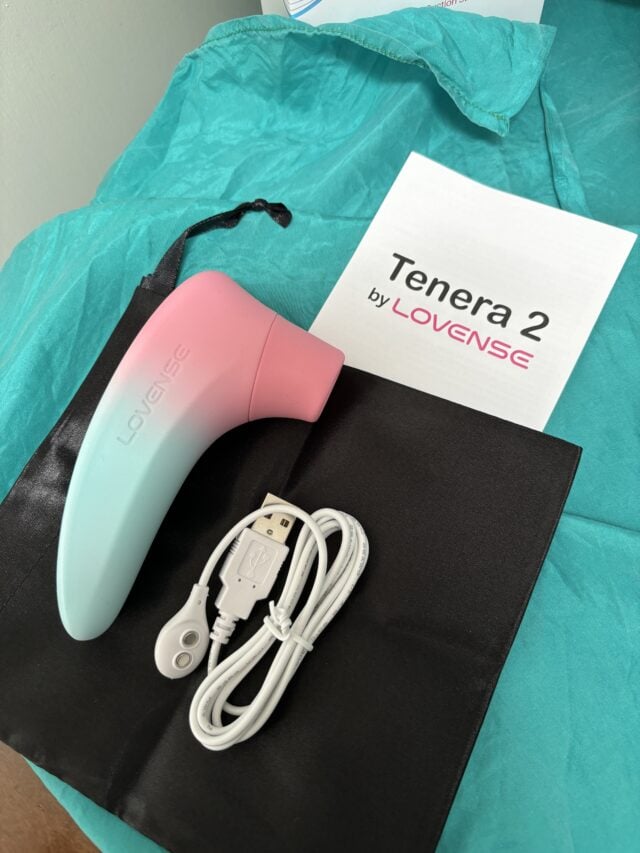 Wireless sex toy Tenera 2 by Lovense with USB charging cable on teal hospital bed. Perfect for remote pleasure, sextech, and innovative intimacy experiences.
