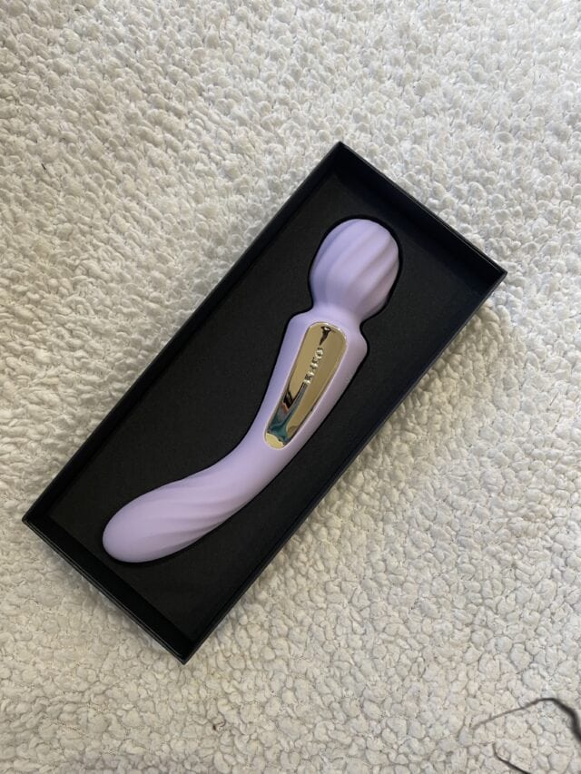 Luxurious lavender sex toy with gold accents, designed for intimate pleasure, presented in elegant black packaging for discreet delivery.