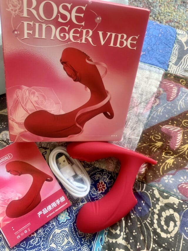 Silicone orgasm vibrator for women, designed for pleasure and intimacy enhancement, with USB charging cable and user manual included.