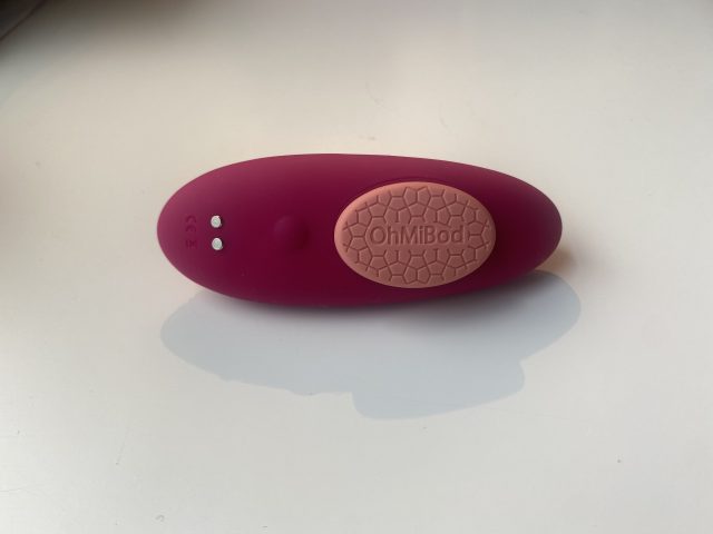 Massage sex toy device for intimate pleasure, pink and purple, OhMiBod vibrating bullet, discreet personal massager, remote-controlled adult toy for couples and solo use.
