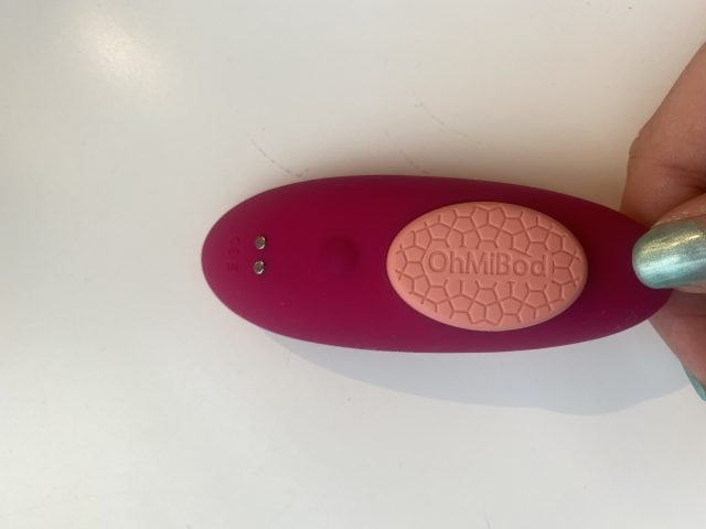 Silicone pleasure device with OhMiBod branding, featuring textured surface for enhanced stimulation, ideal for intimate wellness and personal pleasure.