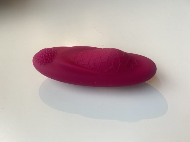 Silicone sex toy with textured surface and honeycomb pattern, designed for enhanced pleasure and stimulation. Ideal for solo or partner intimacy, featuring ergonomic shape and soft, body-safe material.