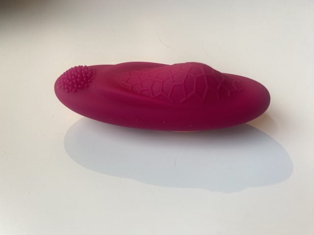 Flexible pink silicone sex toy with textured surface and ridges, designed for personal pleasure and intimacy enhancement. Perfect for discreet use and easy to clean.