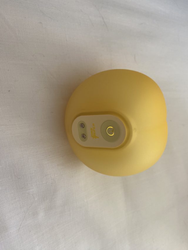 Funny yellow pong ball with a digital device attached for sexual wellness purposes, toy for adult pleasure, innovative sextech product, brightly colored and compact design, used for personal intimacy enhancement.