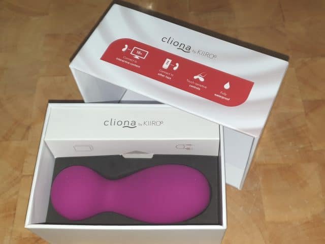A pink Kiiroo Cliona sex toy is sitting in a box, awaits review.