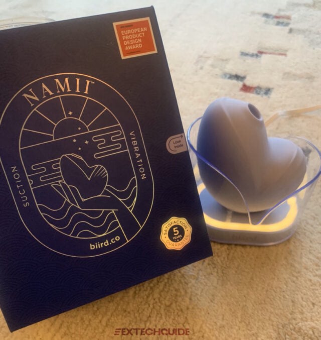 A blue box with a heart on it sits on top of a rug in Namii.