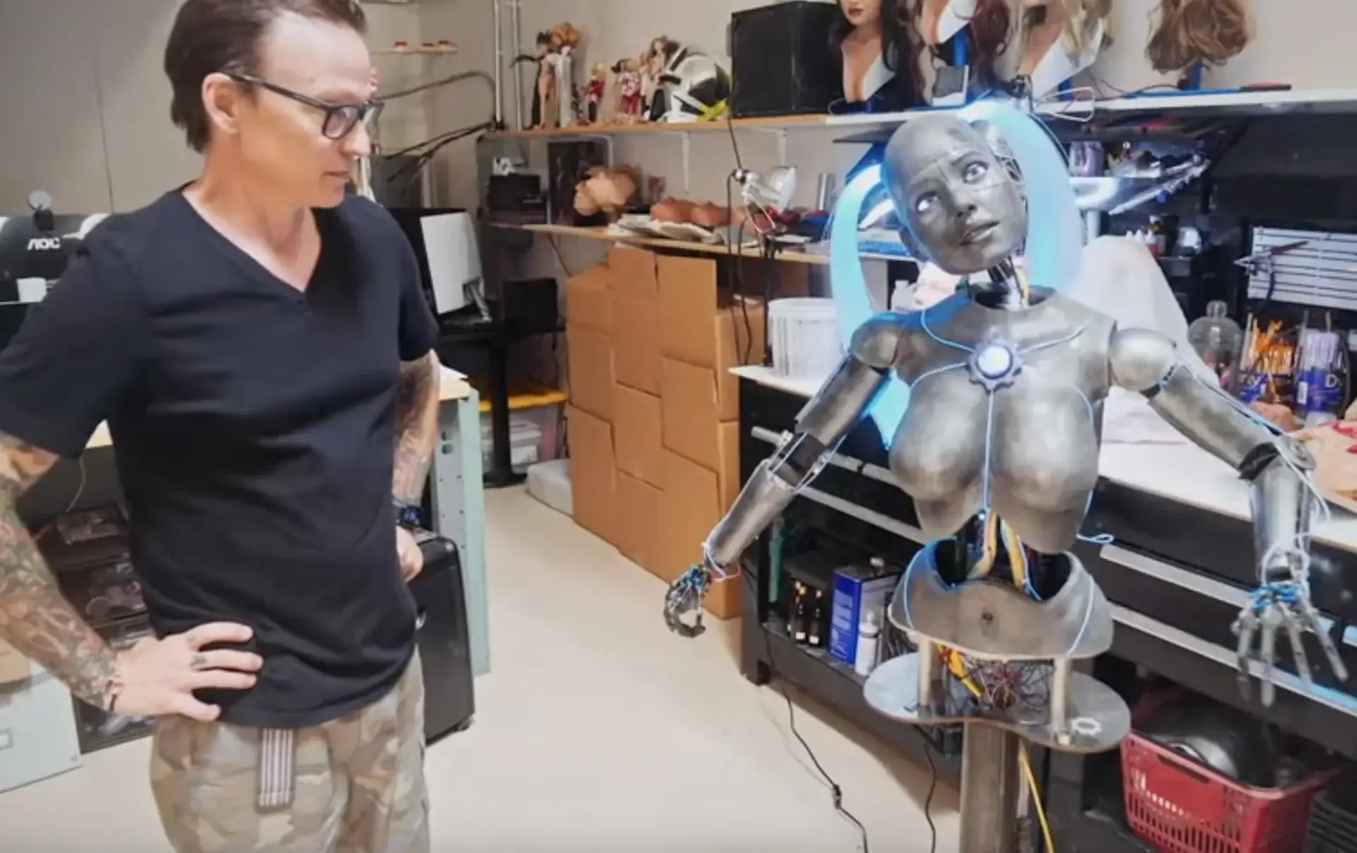 Robotic female sex doll under development in workshop, showcasing advanced humanoid robot with realistic features and artificial intelligence for sextech applications.