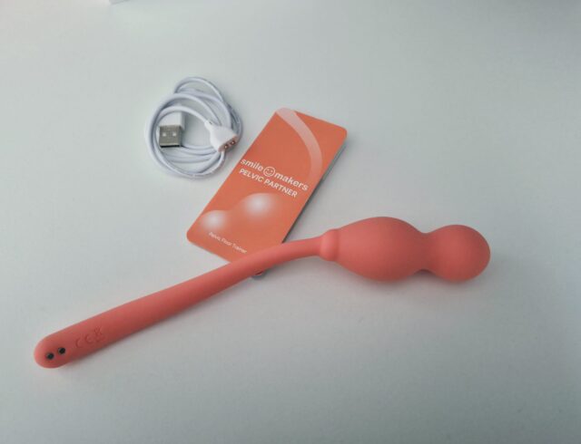Smile Makers Pelvic Partner with charging cable and instructions booklet