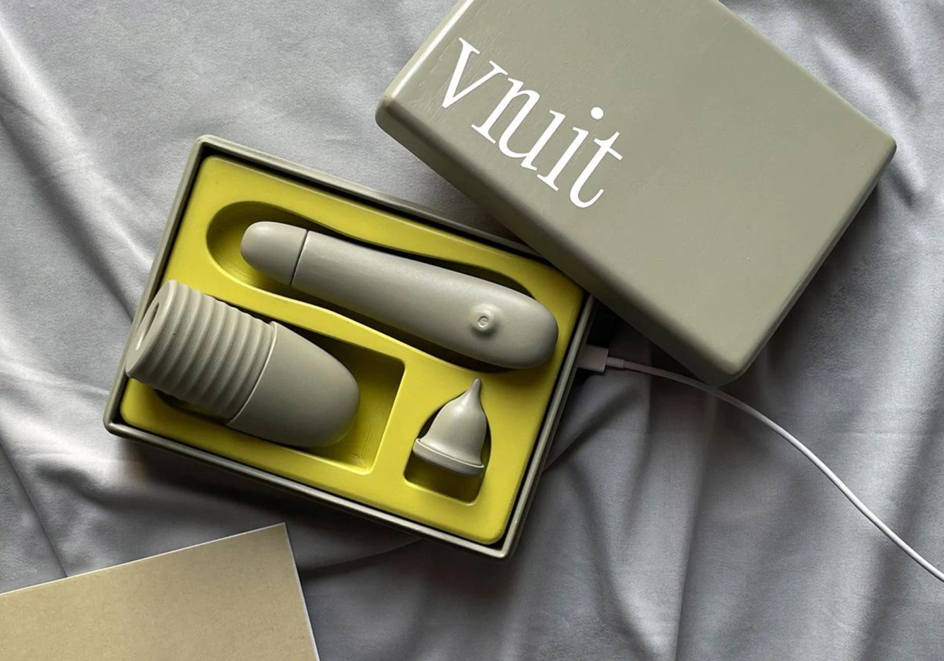 A yellow box equipped with a self-insemination kit, designed for queer people seeking an orgasm-focused experience.