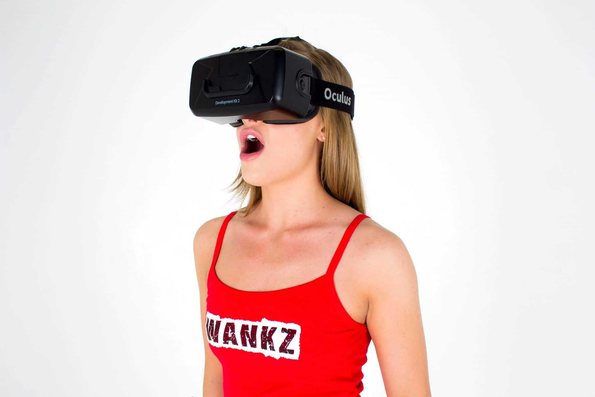 A woman explores cross-industry innovation while wearing a virtual reality headset.