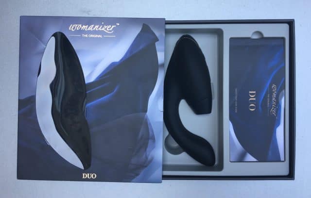 A Womanizer DUO, a black and white vibrator in a box.