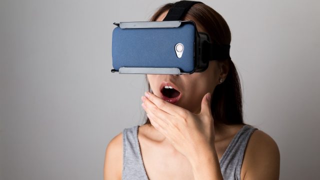 Chinese woman wearing VR headset