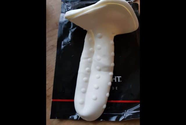 A table featuring the Onyx 2, a white sex toy.