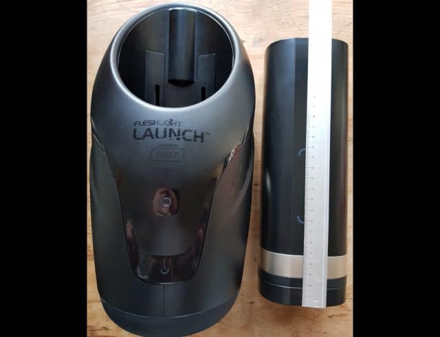 A black Onyx2 device with a ruler next to it.