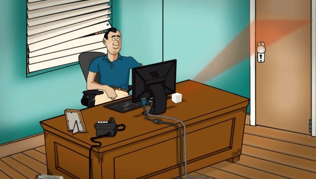 A cartoon man at a desk with a computer is involved in xHamster's crowdfunding effort to prevent exposure while viewing adult content.