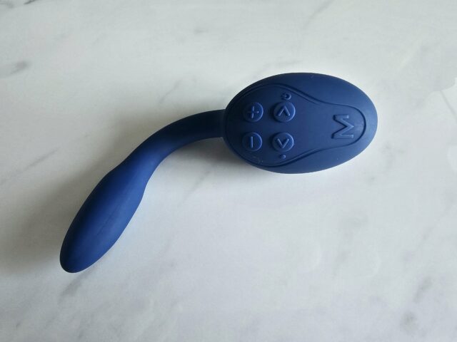 Remote-controlled sex toy vibrator with wireless control buttons for customizable pleasure experiences, made of body-safe silicone in deep blue color.