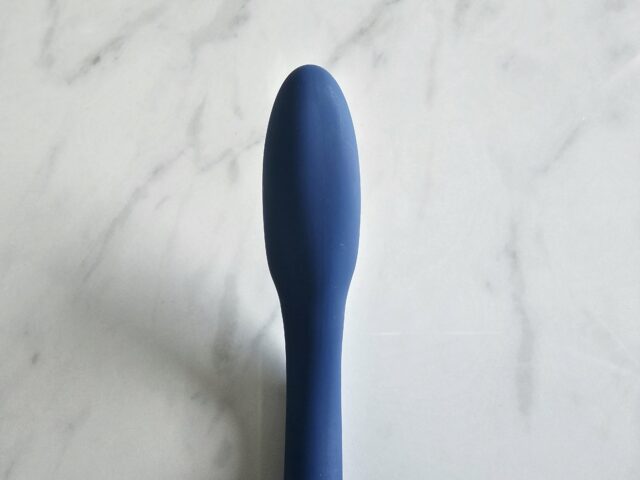 Silicone sex toy, discreet personal massager, blue phallic vibrator, smooth body, versatile adult pleasure product for intimacy and satisfaction.