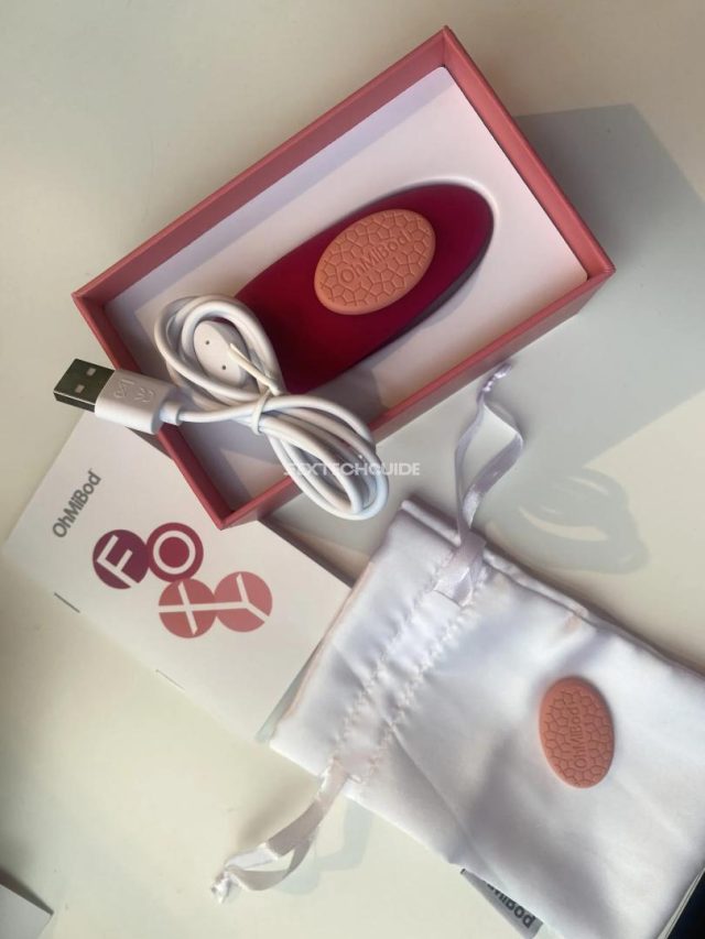 A foxy pink and white box with a small ohmibod device inside.