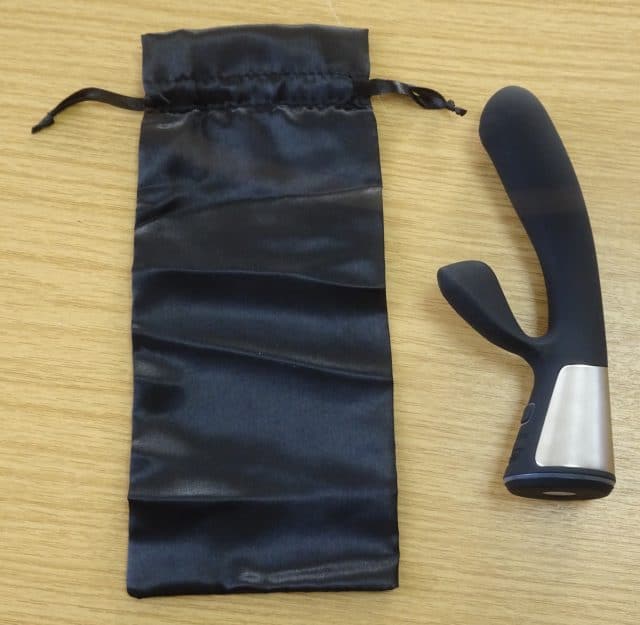 A black sex toy with a pouch - an OhMiBod Fuse.