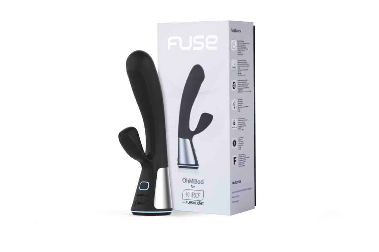 An OhMiBod Fuse review featuring a black sex toy in front of a box.