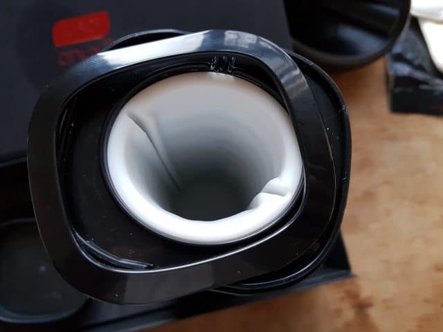 A black coffee cup resembling the Kiiroo Onyx 2.