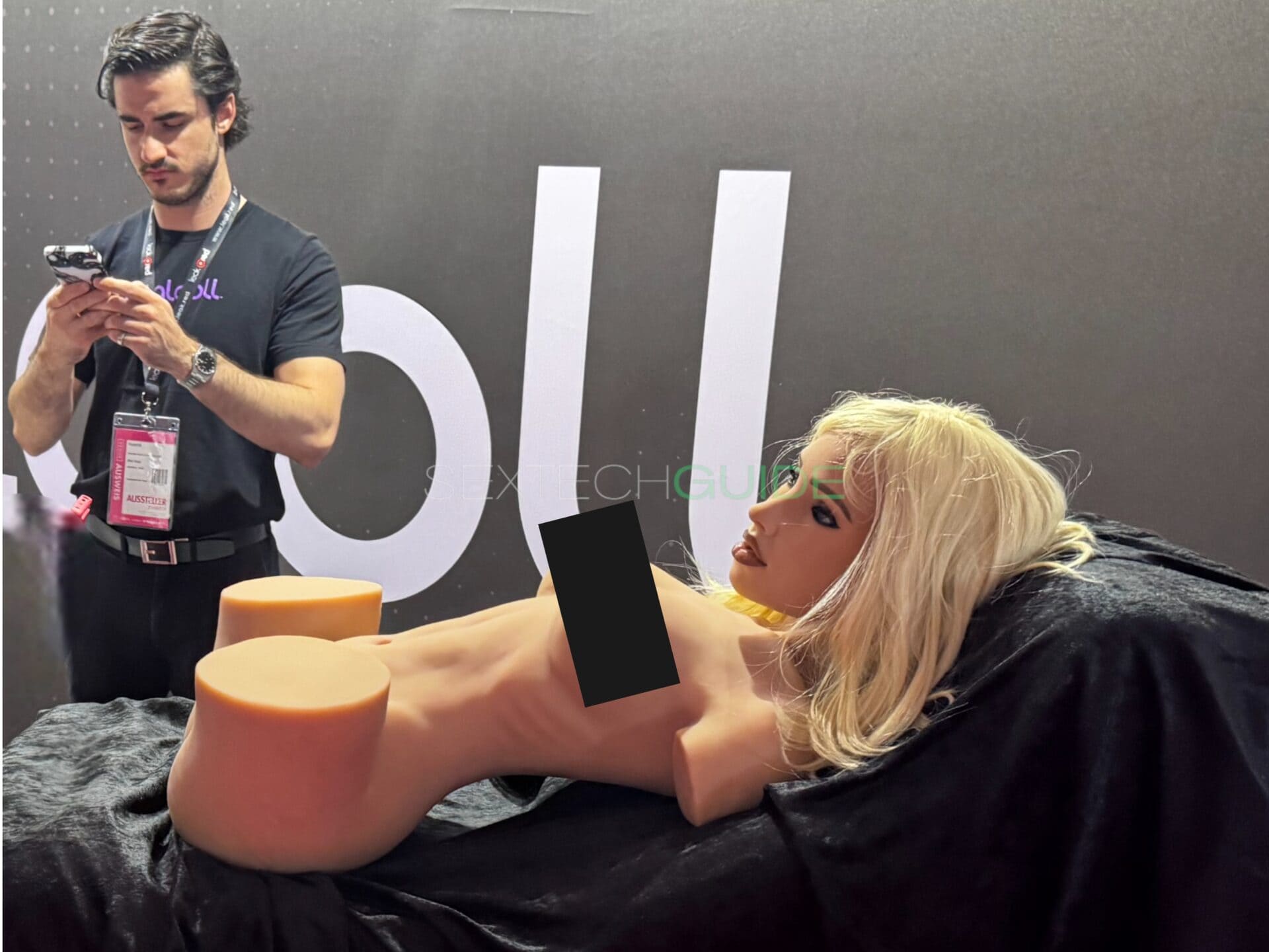 Realistic sex doll at a tech exhibition showcasing advanced adult intimacy products, highlighting innovation in sextech and pleasure enhancement devices designed for personal intimacy experiences.