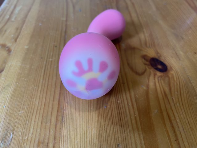 A PinkPunch Sunset Mushroom toy sitting on top of a wooden table.