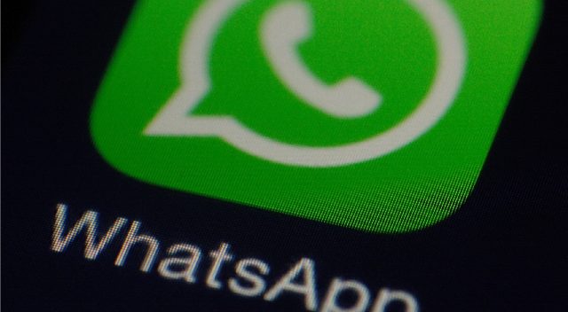 The WhatsApp logo is displayed on a smartphone, while Reddit and lots of other sites are down for many users, likely due to AWS or CloudFlare.