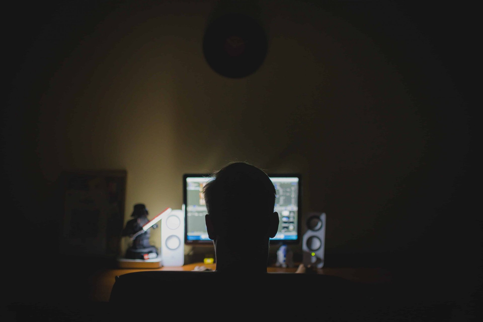 A man sitting in front of a computer, unable to locate adult sites' owners for FBI's 'major hack' warning.