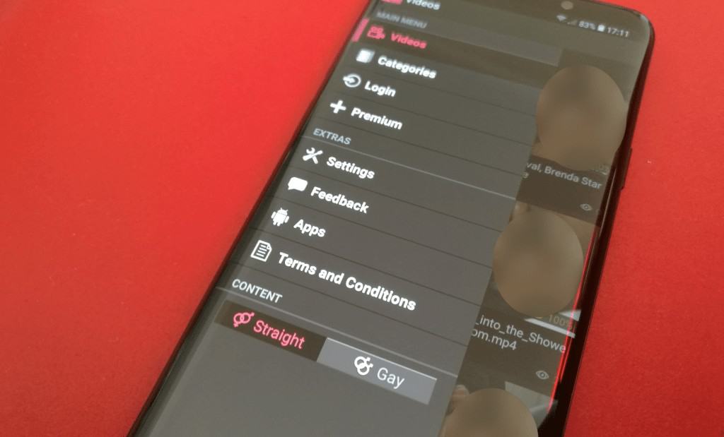 A Samsung Galaxy S10 phone with a vibrant red screen.